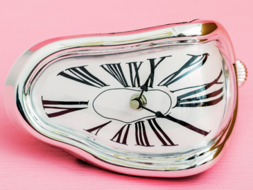 Melting clock with pink background