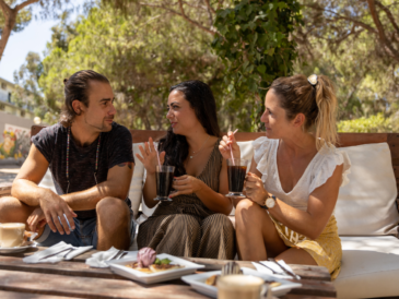 Friends or colleagues eating and sharing together